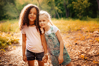 2 young girls in park